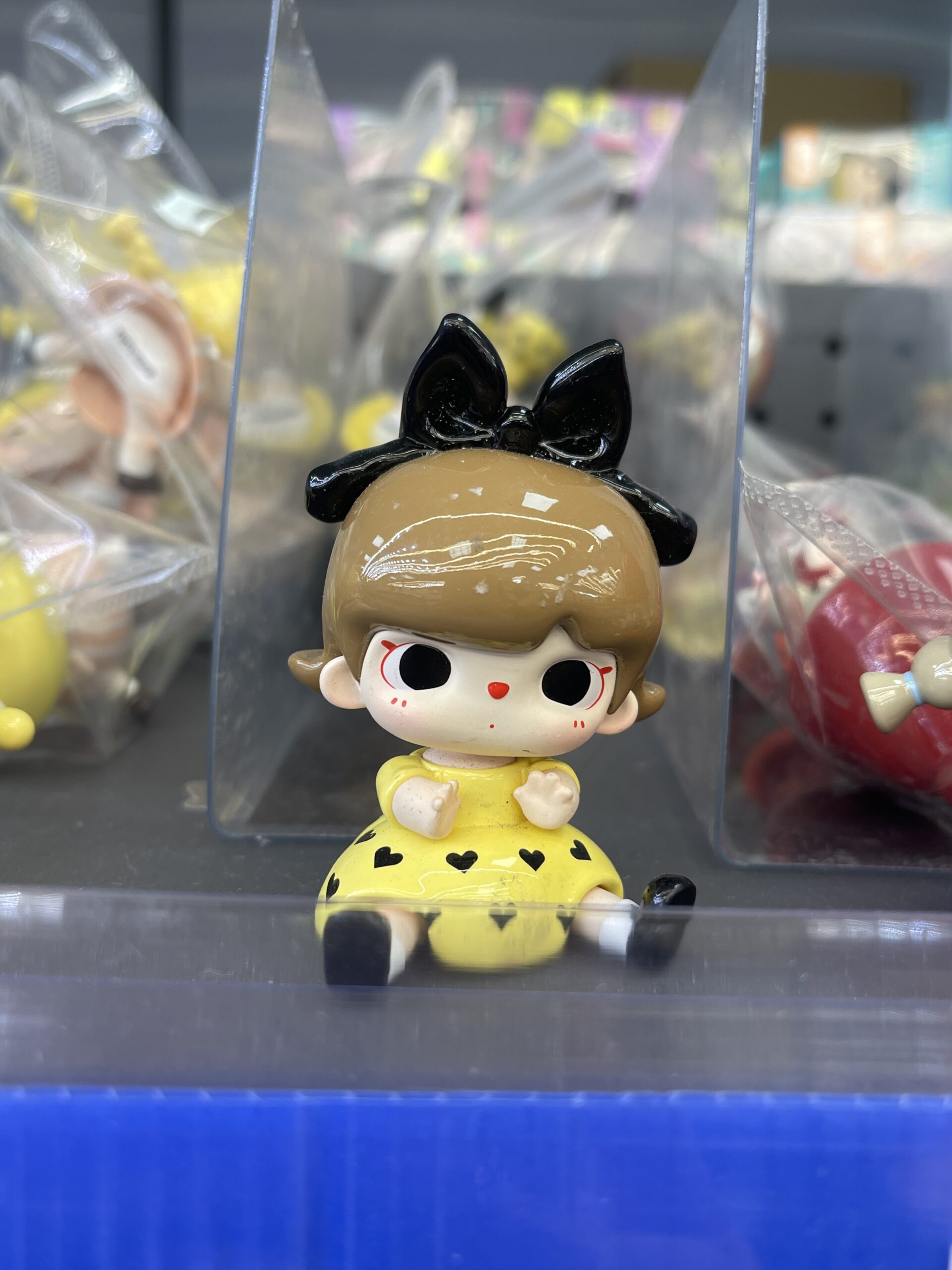 Doll with Black Bow & Yellow Heart Dress Figurine